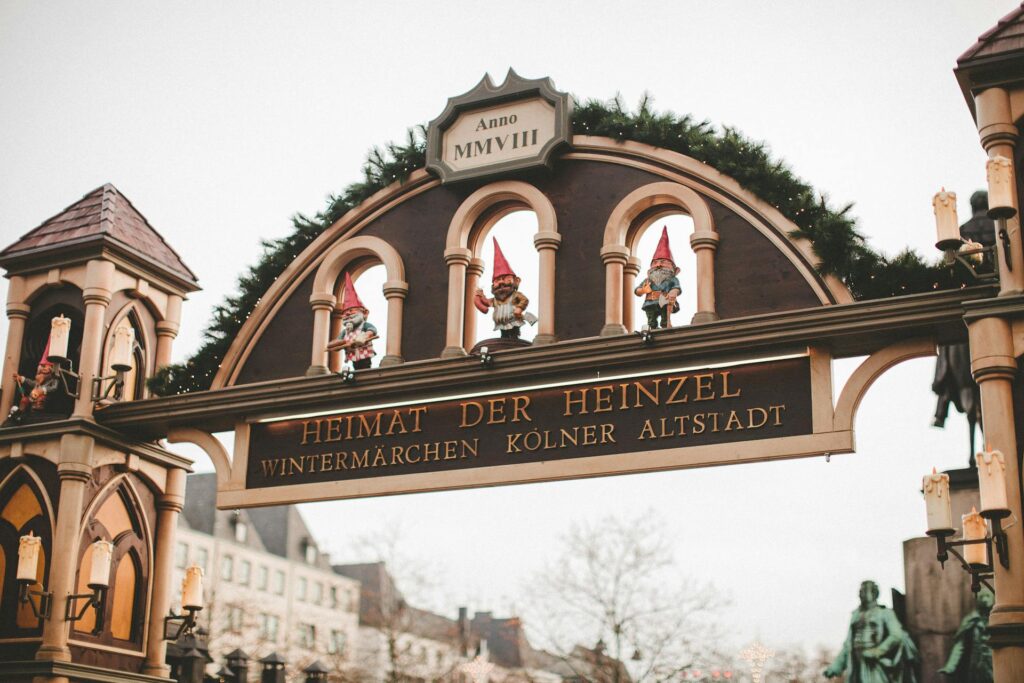 The Cologne Christmas Market with stalls and the Gothic cathedral in the background.