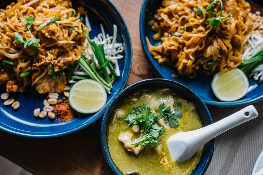 Traditional Pad Thai with shrimp, lime, and crushed peanuts.