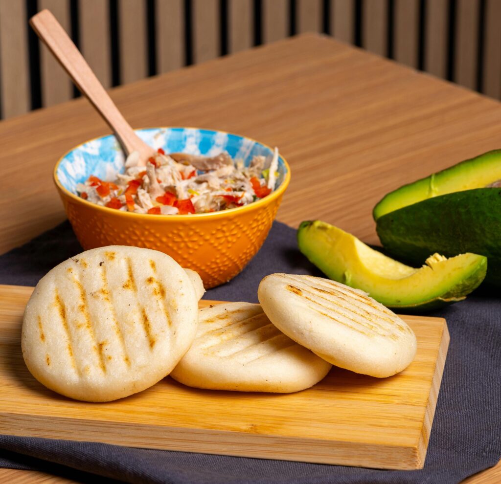 Colombian arepas filled with cheese and served hot off the grill