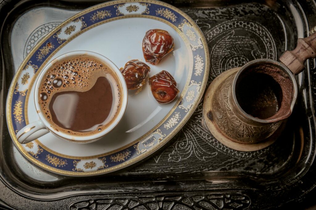 A traditional Turkish coffee setup with a cezve and Turkish delight